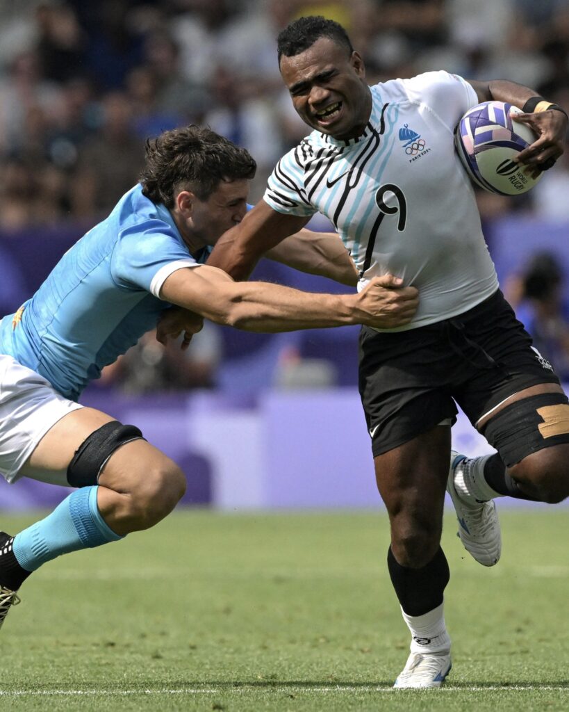 Uruguay's Diego Ardao fought off Fiji's Jerry Tuwai in the men's rugby sevens match.